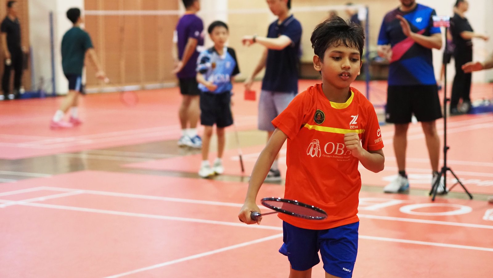 Camper in OBA jersey on court during the OBA Cup