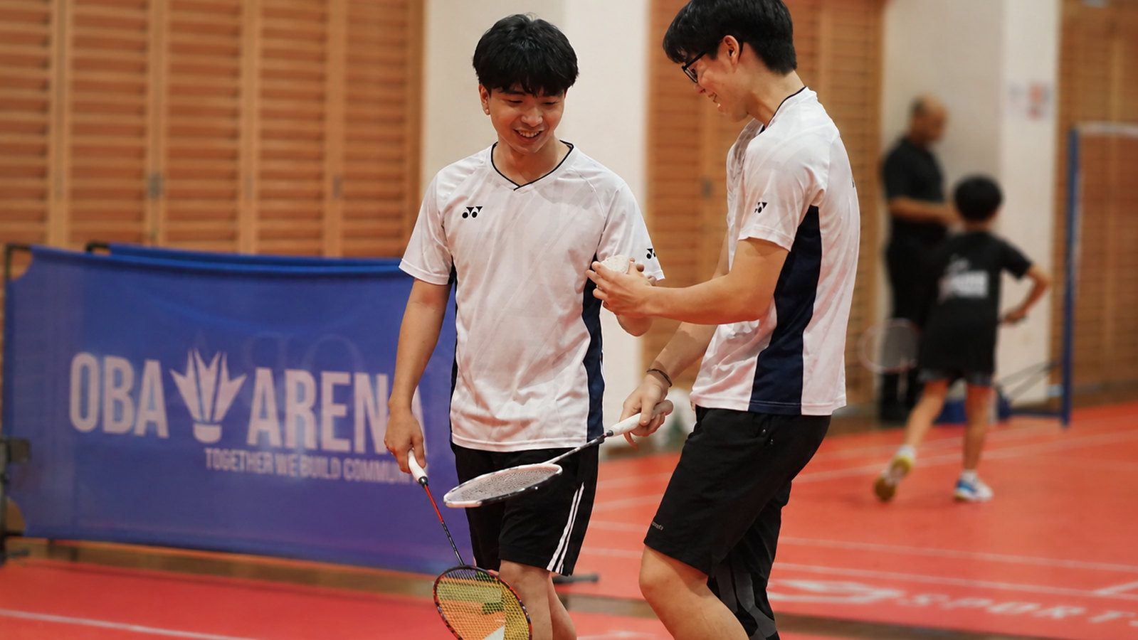 Two players walking on court between points