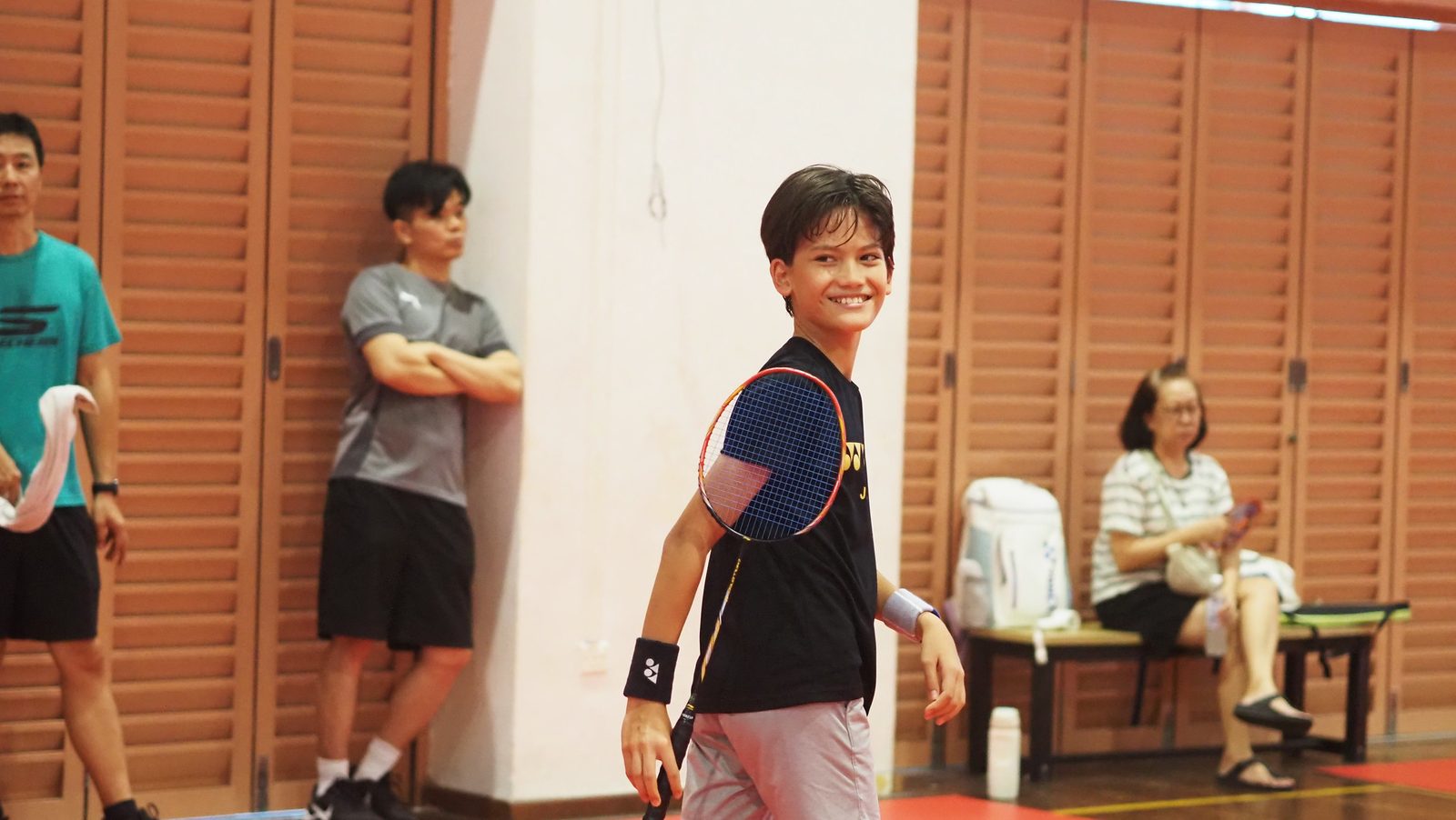 A player smiling on court before a match